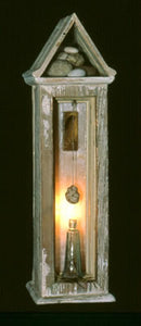 Untitled. wood, stones, resin, antique bottle, feather, light. 24″x6″x6,” 2002