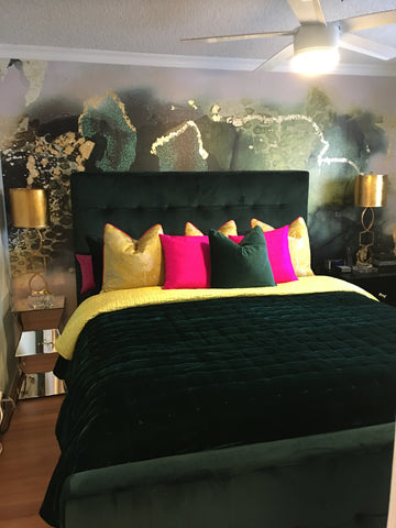 Green and gold themed bedroom decor with large scale abstract wallpaper mural by famous interior design shop Vivian Ferne.