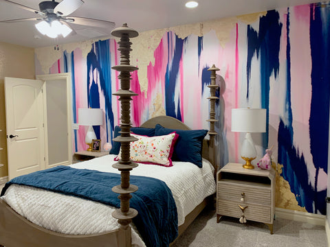 The perfect look for a cozy dorm room or teen bedroom design inspiration. Feature wall with large scale blue, pink and gold abstract wallpaper mural.