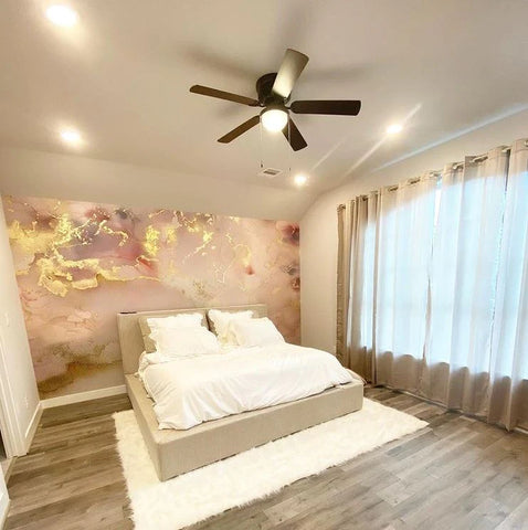 Bedroom accent wall interior design with pink, blush, grey and gold wallpaper mural design by Vivian Ferne. This peel and stick wallpaper is a great decor feature for teen bedrooms or dormrooms in 2023.