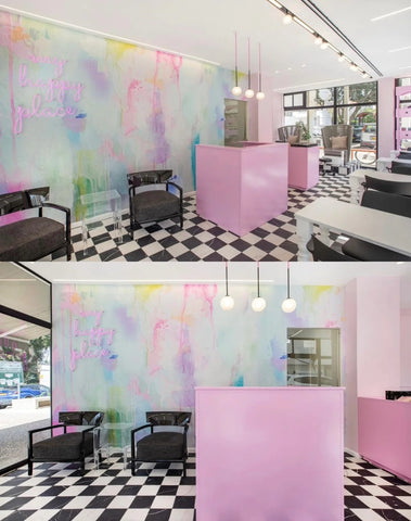 Nail salon interior design installation with large abstract wallpaper mural featuring blues, pinks, limes and blush tones.