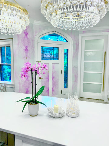 Entry way decor inspo with purple pattern wallpaper, white trim and matching chandelier set. Colorful accent walls in kitchens and entry ways will change the feeling of your entire home.