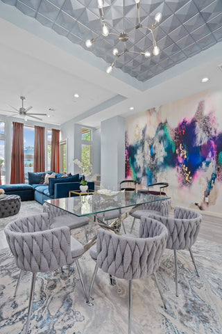 Luxury dining room interior design concept with abstract wallpaper mural design by Vivian Ferne. Concept features soft gray tones, blues, purples and golds on the accent wall.