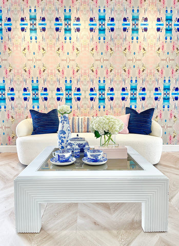 Large pattern wallpaper mural design with blues, pinks creams and blush tones.