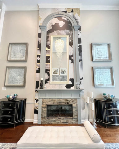 Luxury Texas home with high ceilings. Fireplace decorated with abstract peel and stick wallpaper mural from Vivian Ferne.