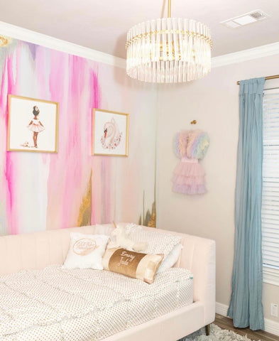 Stunning pink themed kids bedroom with pink day bed and large abstract pink wallpaper mural.