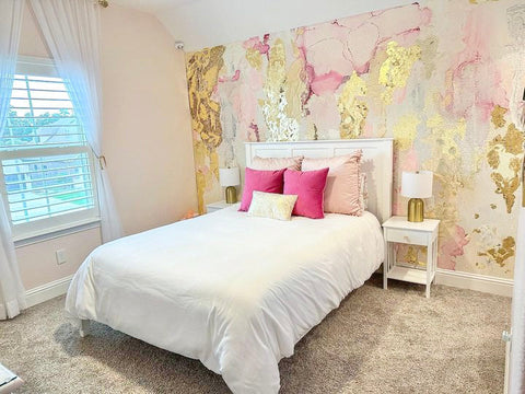 Teen bedroom interior design concept with pink accent wall. Wall is decorated with large abstract pink wallpaper mural in peel and stick material.