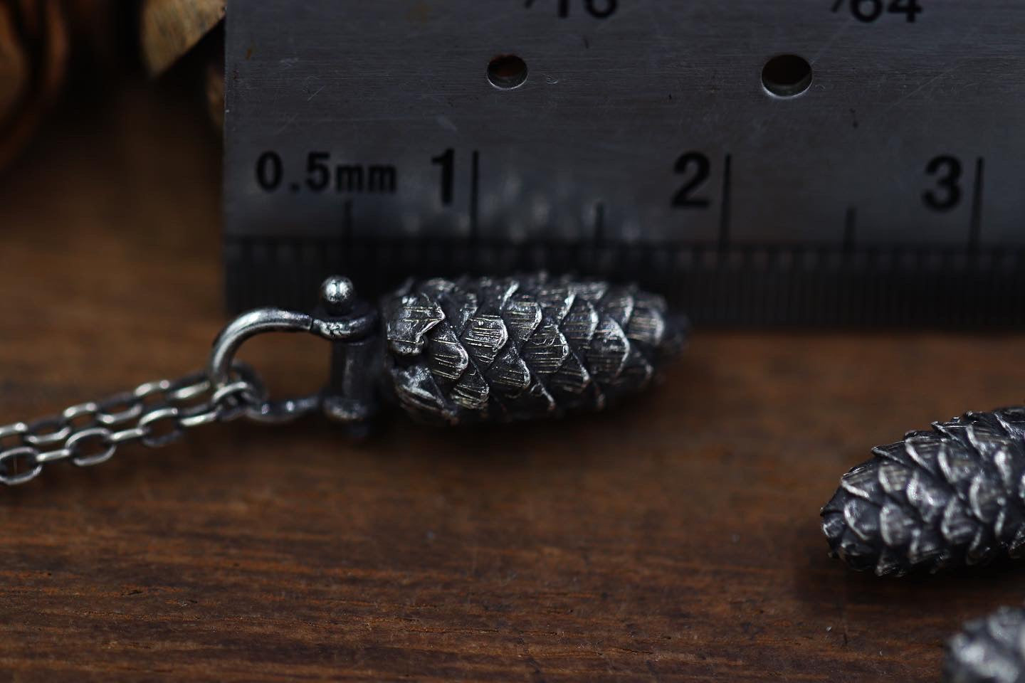 Extra tiny pinned solid sterling silver hemlock cone necklace