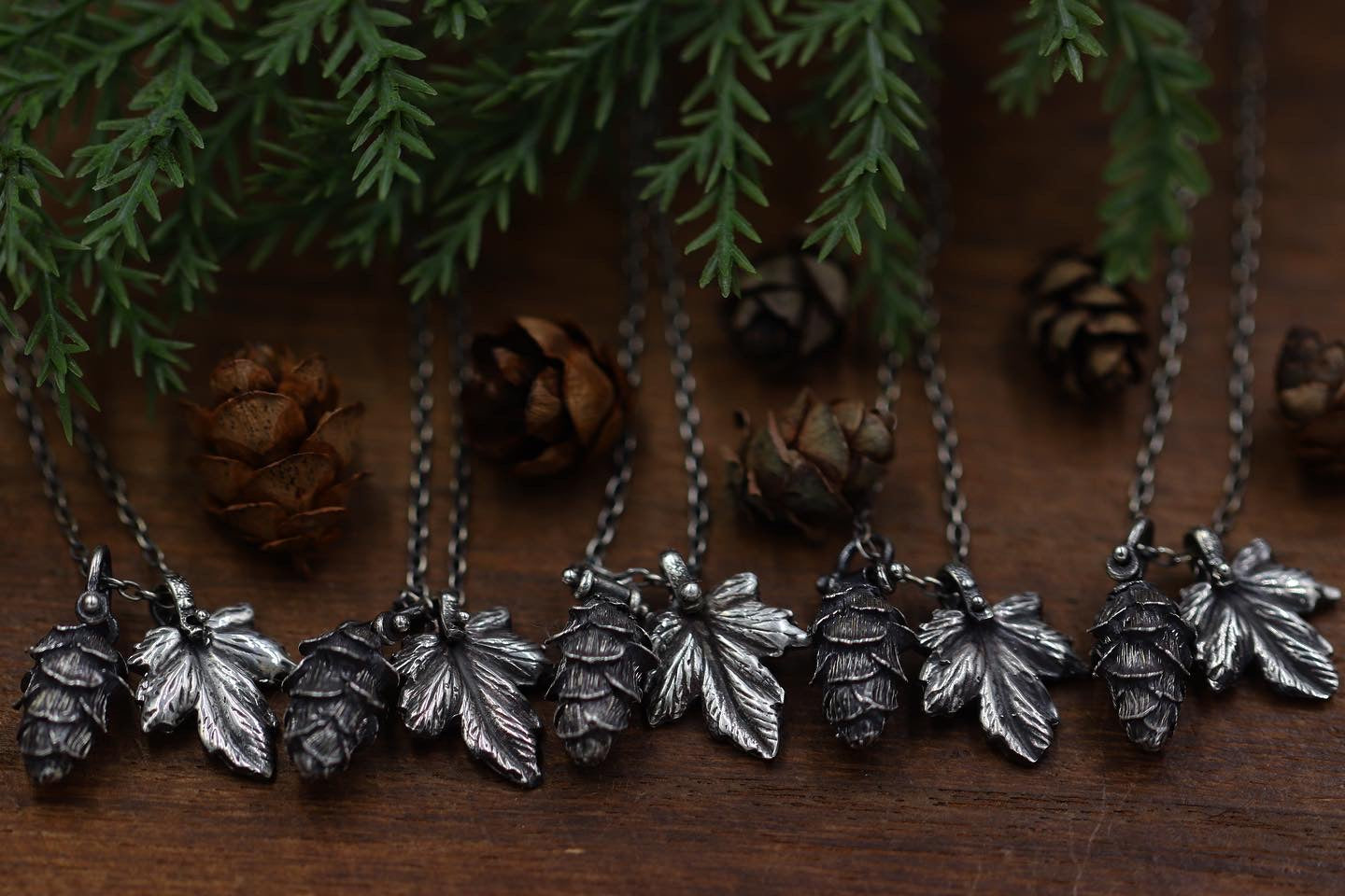 Tiny pinned solid sterling silver hemlock cone and leaf necklace