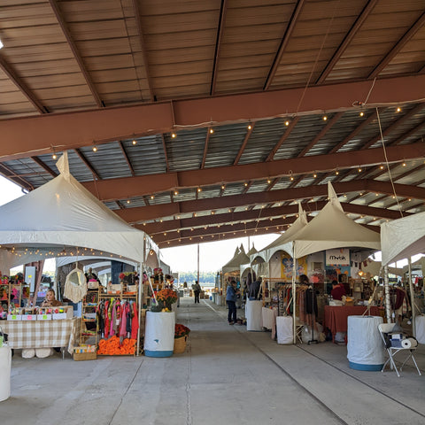 A view of one of the aisles of booths at Wool & Folk