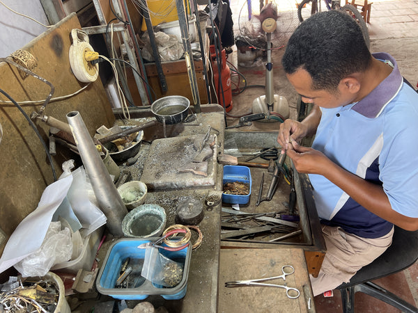 artisan making recycled bullt jewelry