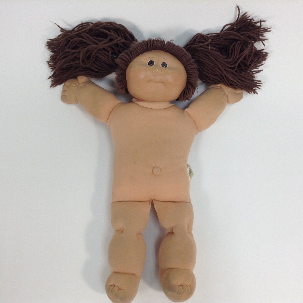 cabbage patch doll with pigtails