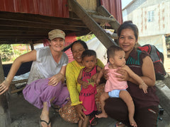 Anna collaborating with a local family