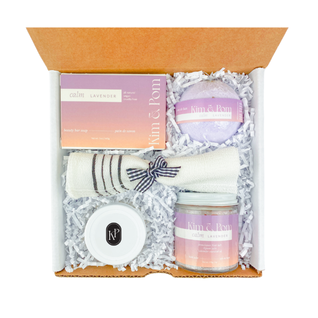Spa gift box including bath salts, face mask, bath bomb, scrub towel, soap.