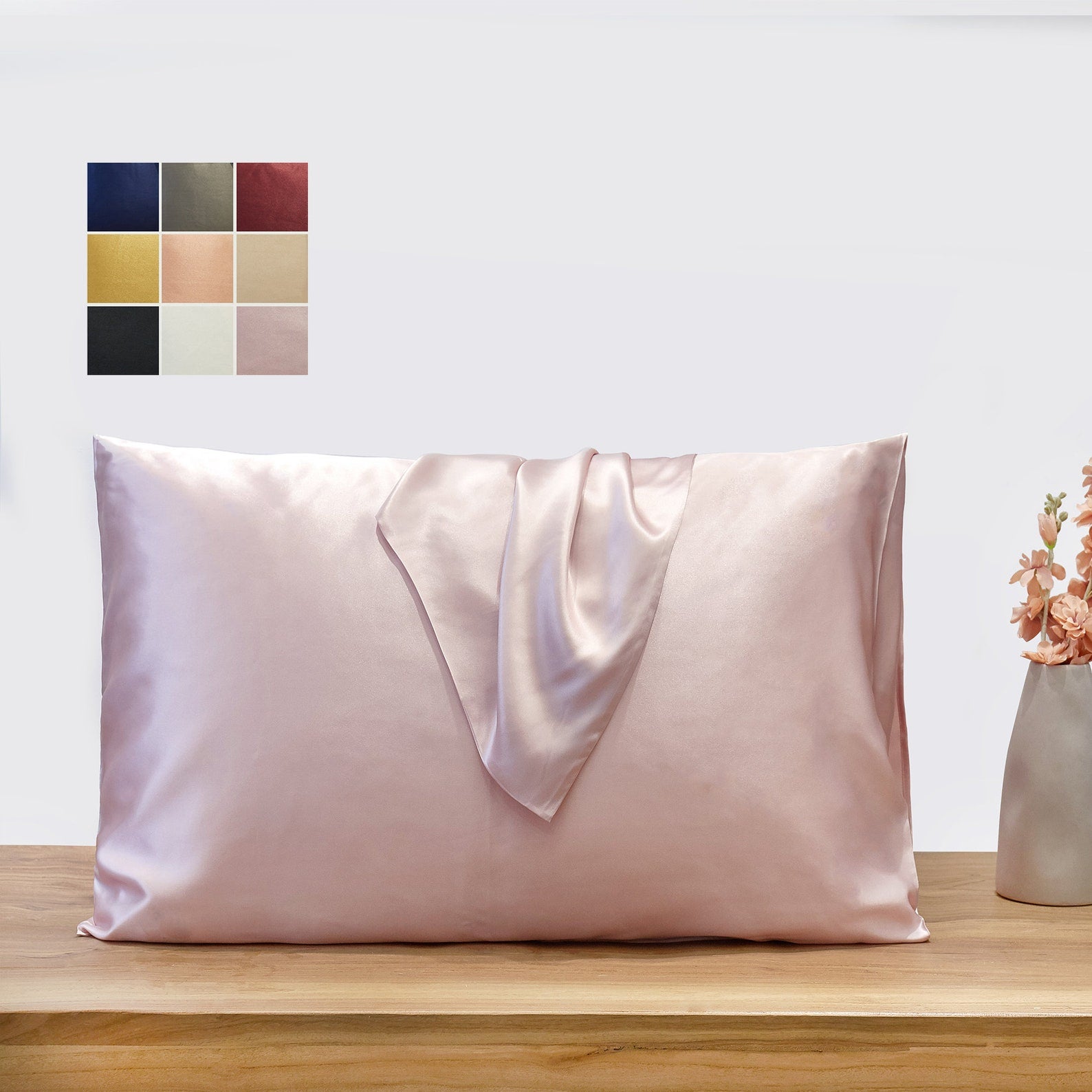 Light pink silk pillowcase wrapped around a pillow.