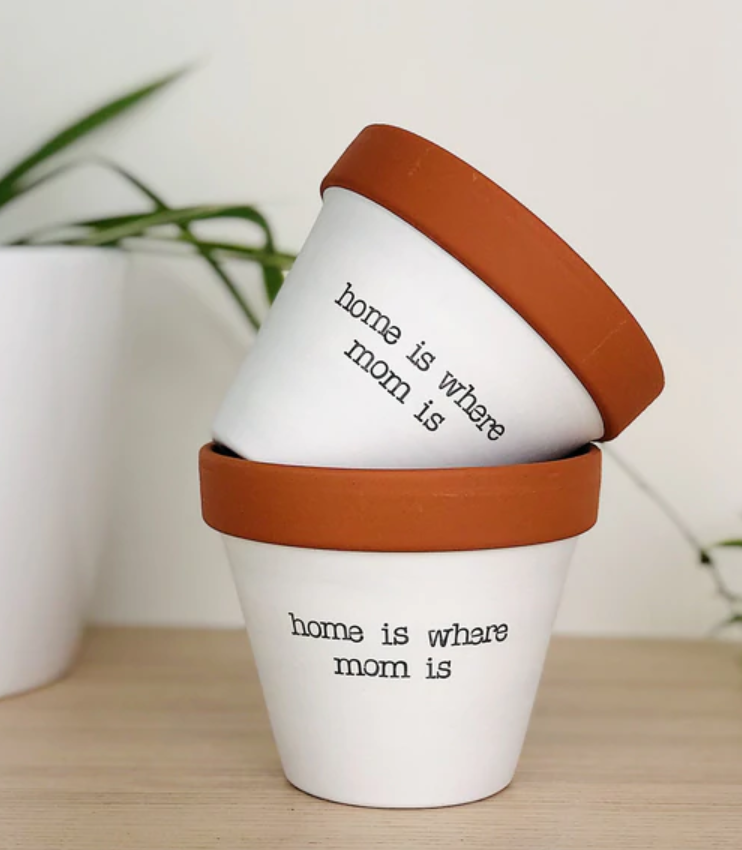 Plant pots that say "home is where mom is".