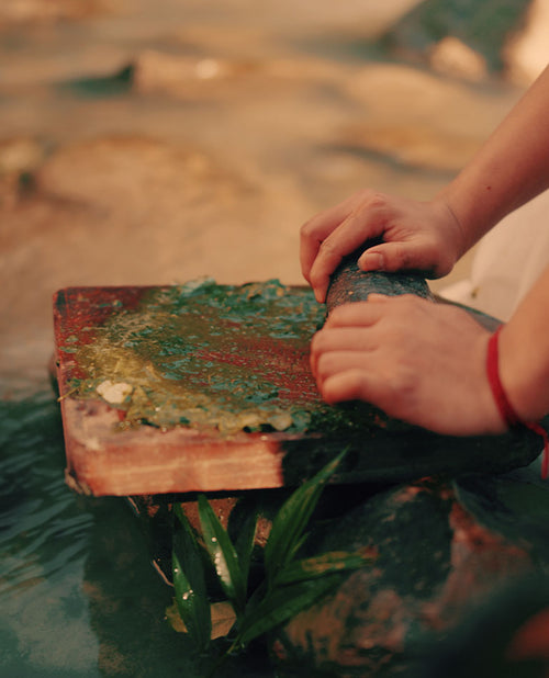 Woman grinding herbs