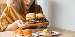 Hungry woman eating junk food