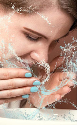 water splashing on face.