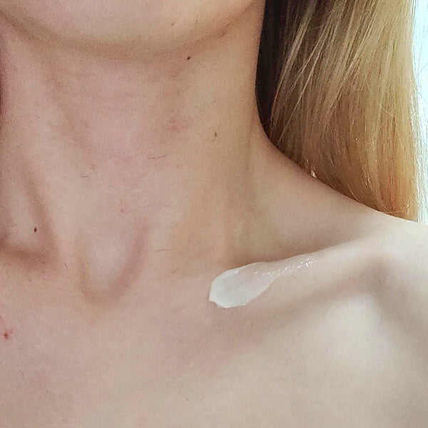 An image of a woman applying Nicumin Even-Toning Cream