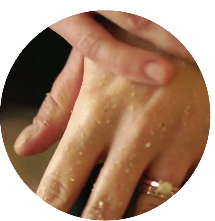 Image of hands shown applying natural products.