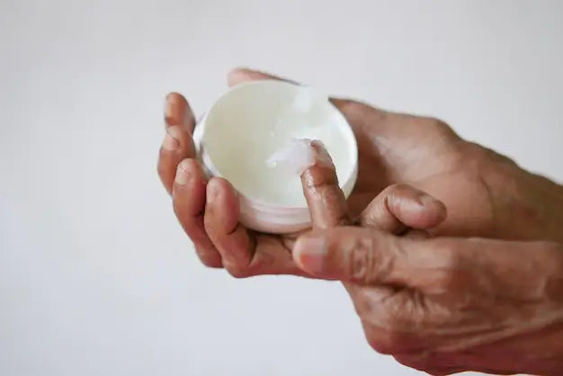 taking pinch of Petroleum Jelly on finger