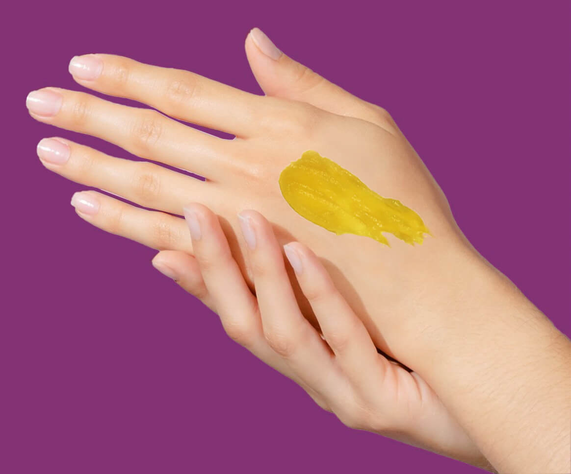 Ghee applied on a hand of woman 
