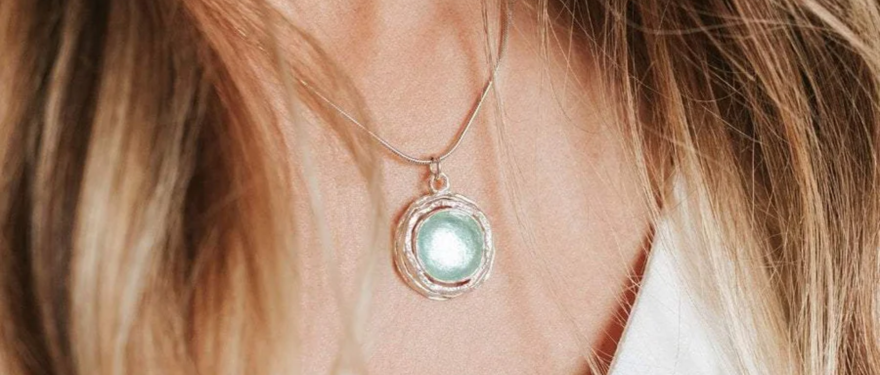 TRANSLUCENT ROMAN GLASS PENDANT IN WRAPPED STERLING SILVER