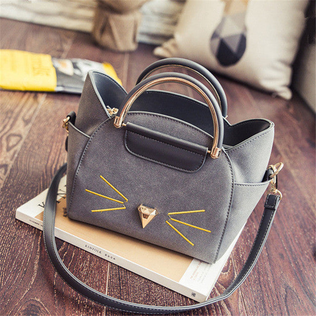 golden meow kors handbag