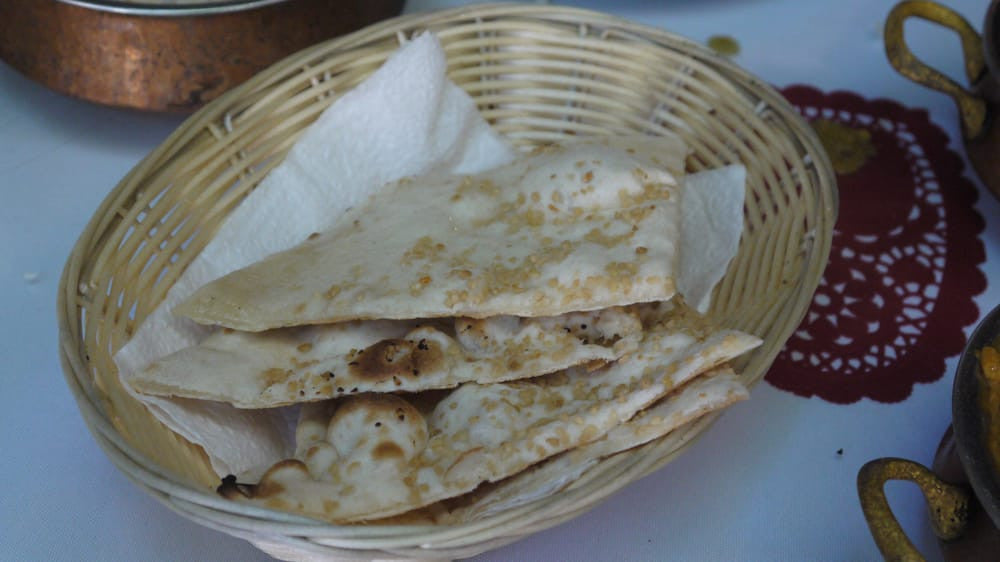 57. Keema Nan White flour bread stuffed with mildly spiced minced lamb
