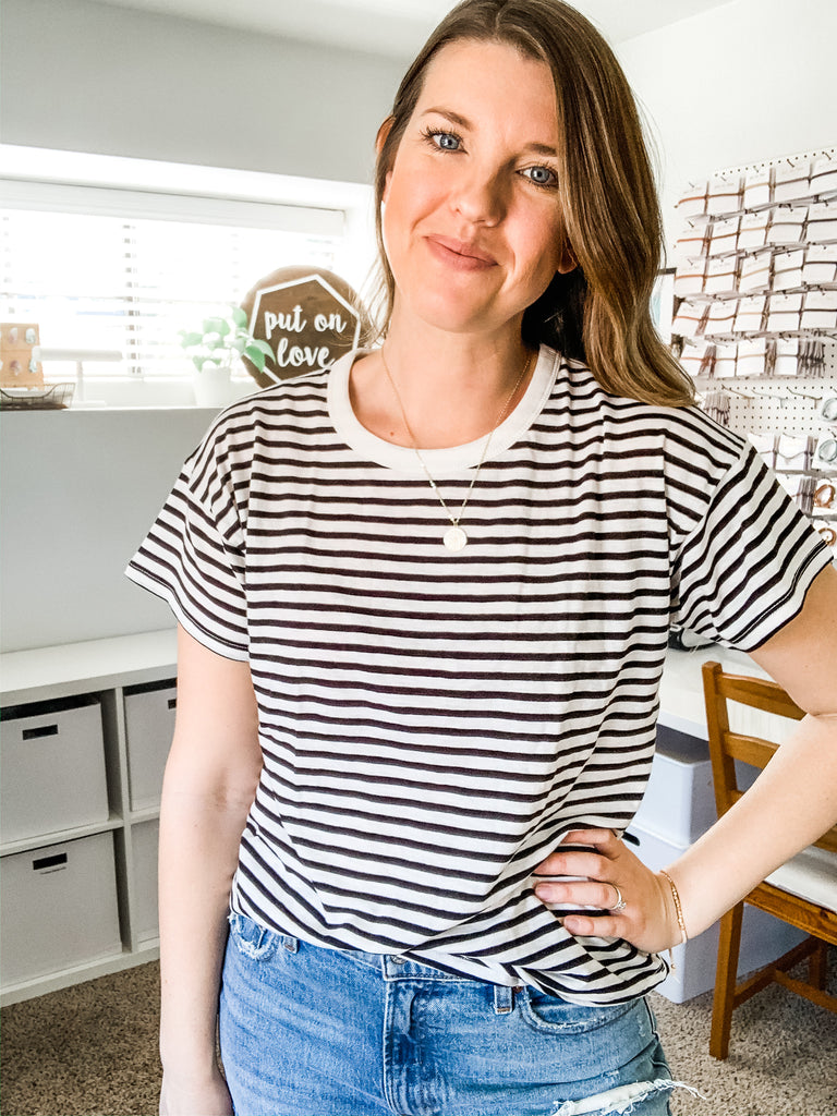 necklace on brown outfit