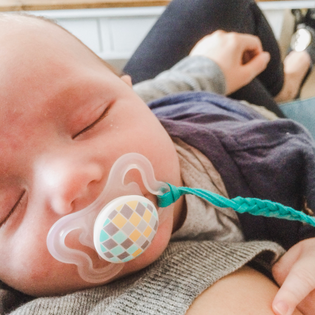 Everson wearing my first essential oil diffusing pacifier clip!