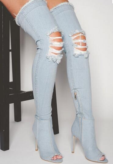 ripped jeans and thigh high boots