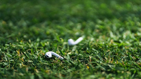 Apple AirPod on Green Grass