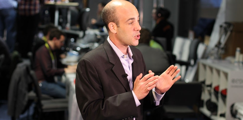A man talking in a broadcasting room