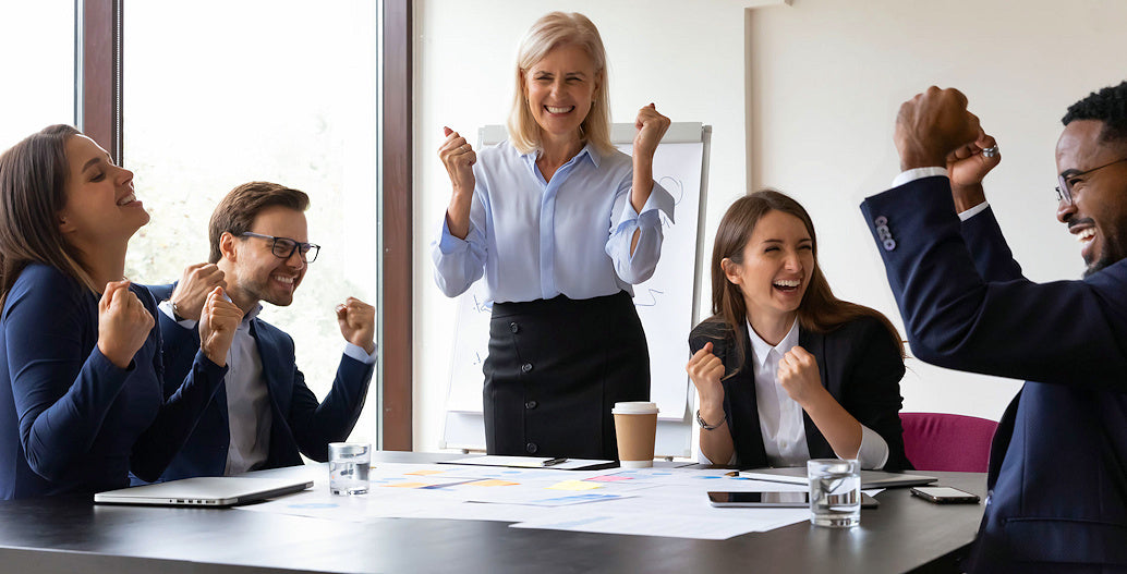 A group of employees looking excited.