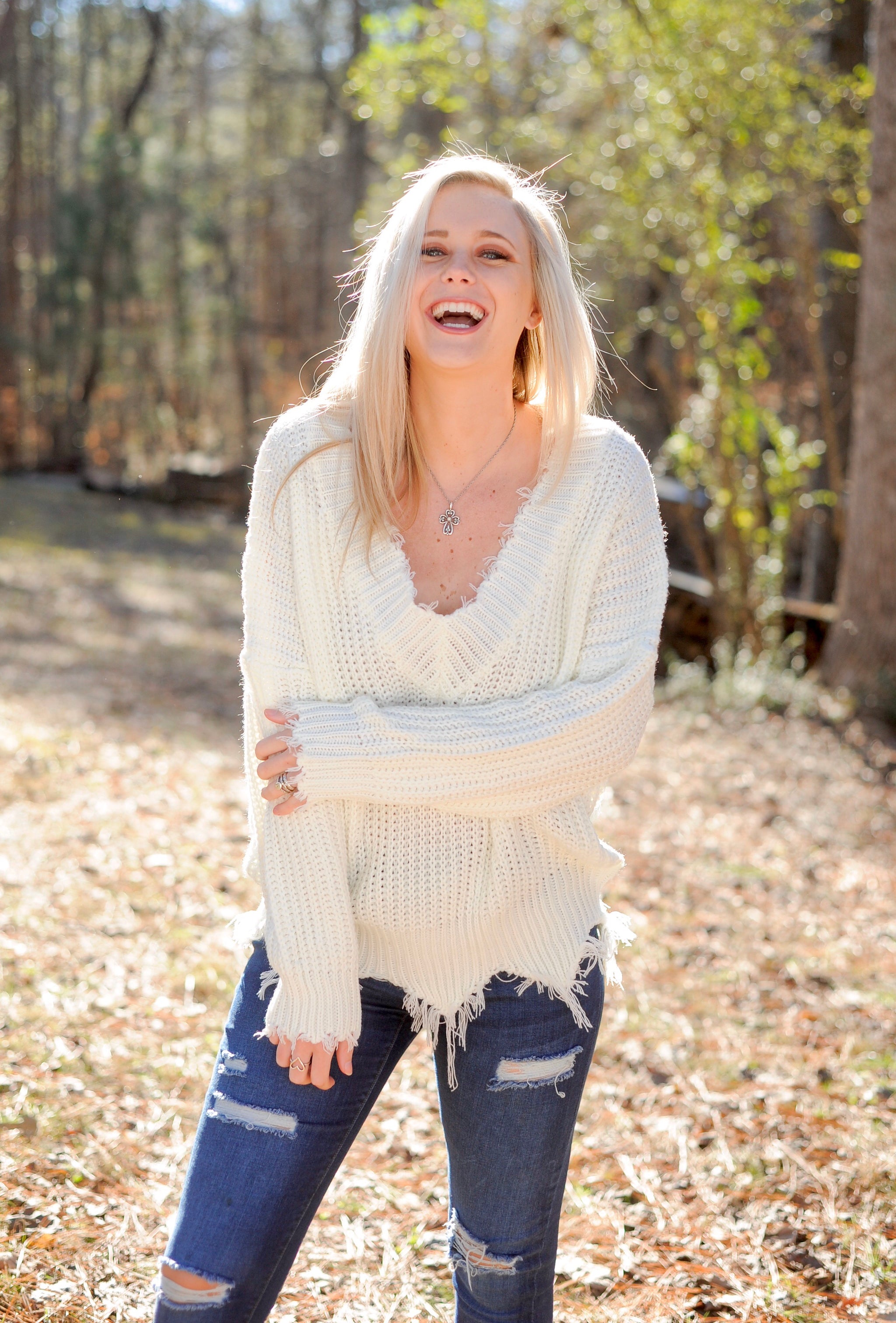 white frayed sweater