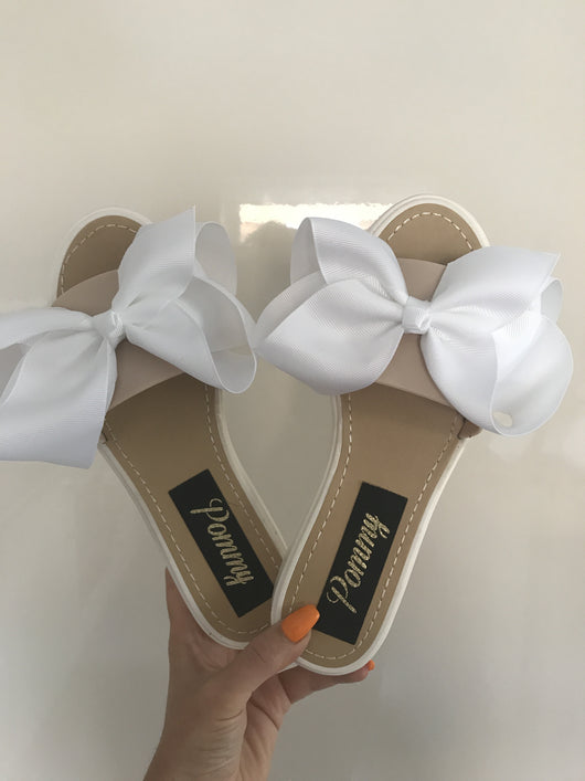white slides with bow