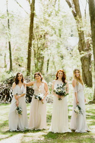 Bridesmaids and bride in a forest