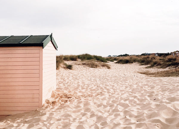 pink beach hut on southwold beach
