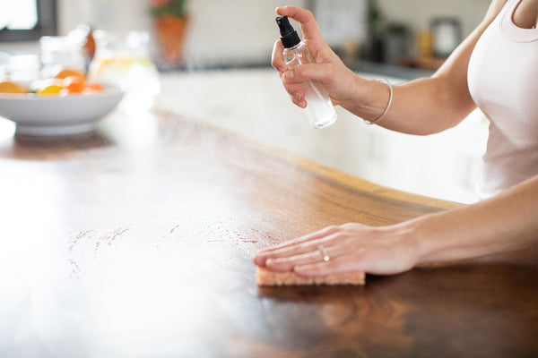 natural cleaning with essential oils in a spray bottle