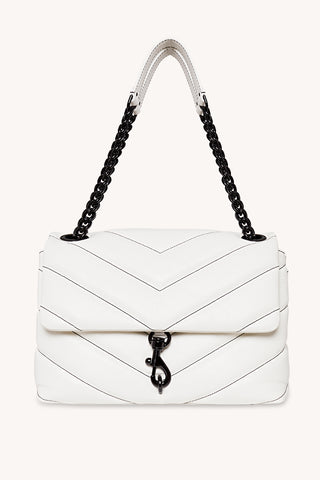 The newest Edie to join the club is the most spacious of them all. Crafted from chevron-quilted leat