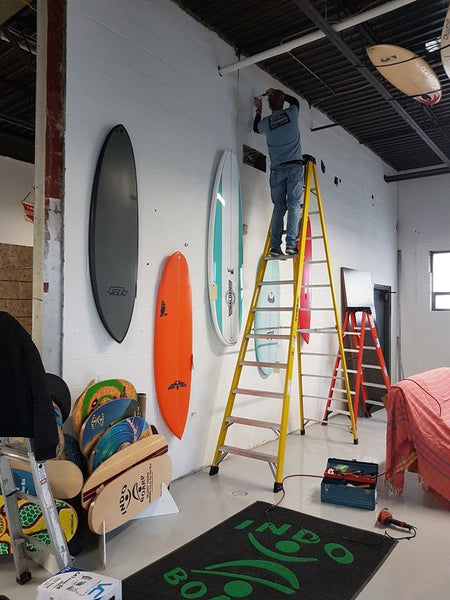 Grant setting up the magical 'gnarwall' of surfboards. To date none have fallen down.