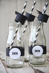 Darling drink glasses with black cardstock graduate cap on a straw.