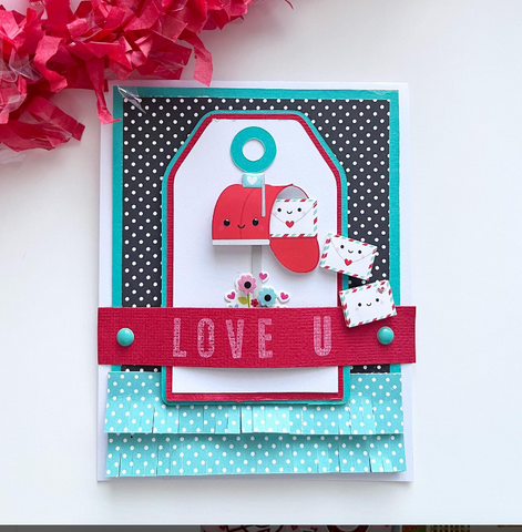 Handmade Valentine's Day card with a cartoon mailbox and polka dot fringe.