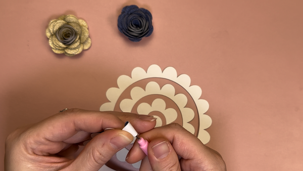 making rolled roses from glitter paper