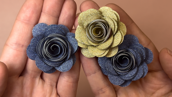 making rolled roses with glitter paper