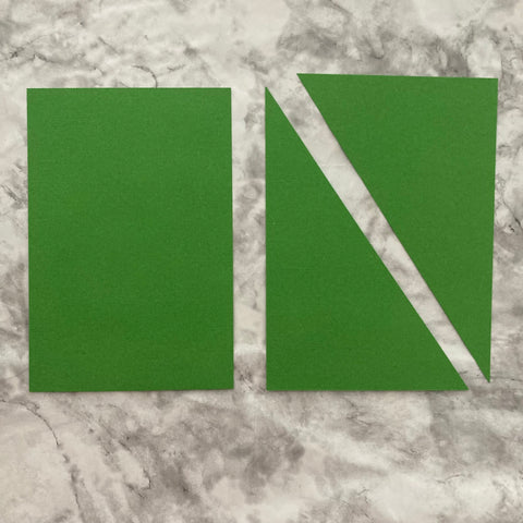 Green cardstock cut to make a handmade Christmas card