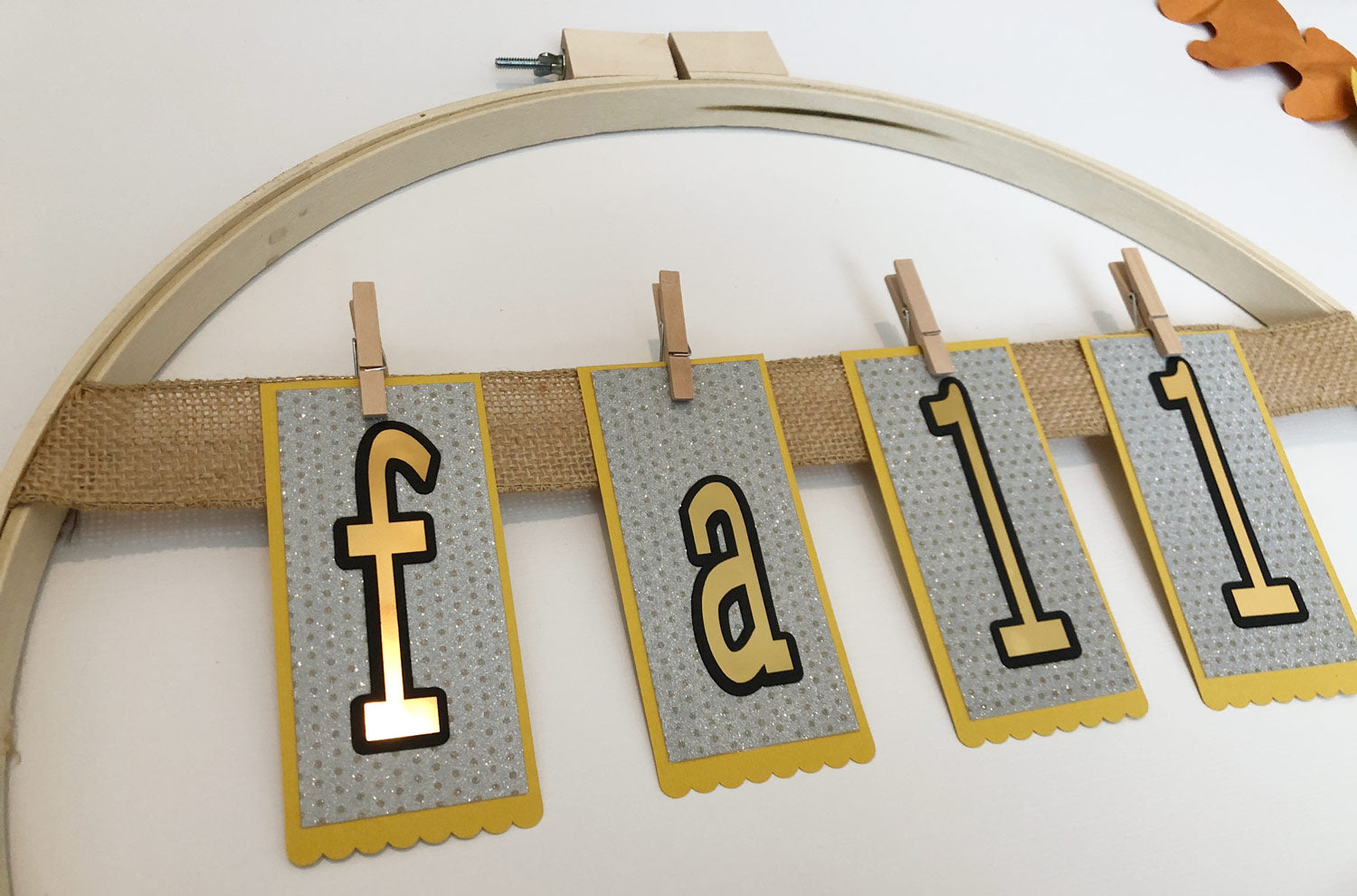 fall paper banner attached to burlap ribbon