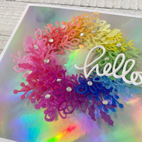 rainbow vellum wreath on a holographic background